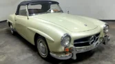 Front view of a 1956 Mercedes Benz 190SL with a new metallic cream mist paint job