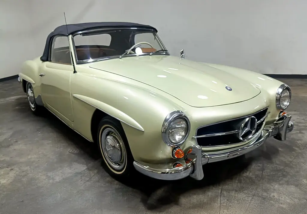 Front view of a 1956 Mercedes Benz 190SL with a new metallic cream mist paint job