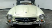 Front view of a 1956 Mercedes Benz 190SL with a new metallic cream mist paint job