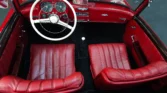 Interior of a 1957 Mercedes-Benz 190SL showcasing the vintage dashboard and seats. Classic Cars for sale