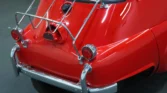 Rear view of 1958 BMW Isetta 300 in classic red