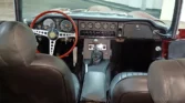 Luxurious black leather interior of a restored 1970 Jaguar E-Type 4.2 (2+2).