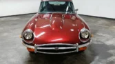 Front view of a 1970 Jaguar E-Type 4.2 (2+2) with a new metallic maroon paint job Classic Cars for sale