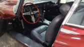 Luxurious black leather interior of a restored 1970 Jaguar E-Type 4.2 (2+2).