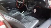 Luxurious black leather interior of a restored 1970 Jaguar E-Type 4.2 (2+2).