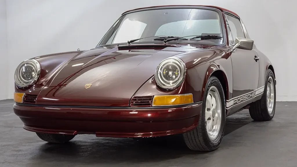 Auto Mart Motors Front view of a 1972 Porsche 911 Targa with a new metallic maroon paint job