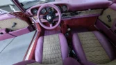 Luxurious burgundy/brown interior of a fully restored 1972 Porsche 911 Targa.