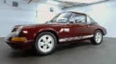 Side view of a 1972 Porsche 911 Targa showcasing its semi-convertible Targa body style and sleek design