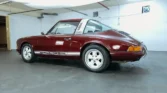 Side view of a 1972 Porsche 911 Targa showcasing its semi-convertible Targa body style and sleek design