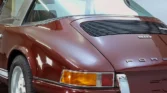 Side view of a 1972 Porsche 911 Targa showcasing its semi-convertible Targa body style and sleek design